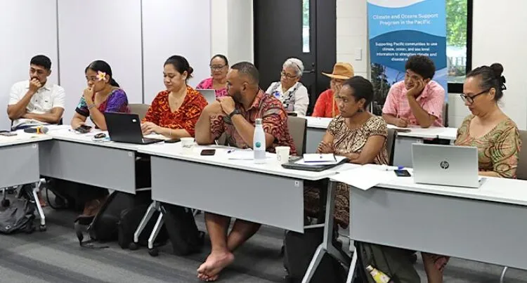 Journalists sat together at desks for training