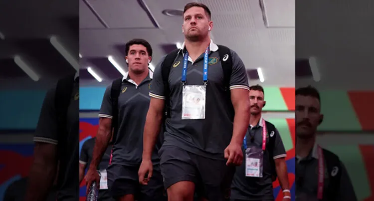 A photo of Wallabies representatives Ben Donaldson, David Porecki (captain) and Nic White walking through a room.