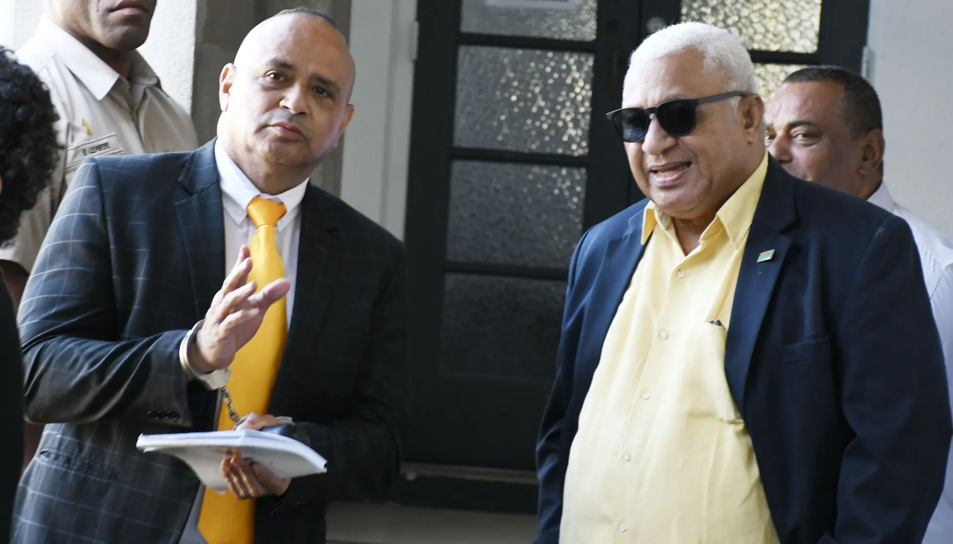 Former Police Commissioner Sitiveni Qiliho and former Prime Minister Voreqe Bainimarama outside the High Court in Suva