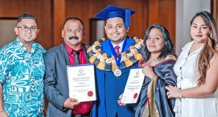 A photograph of Monishkar Naidu with family holding two certificates.   