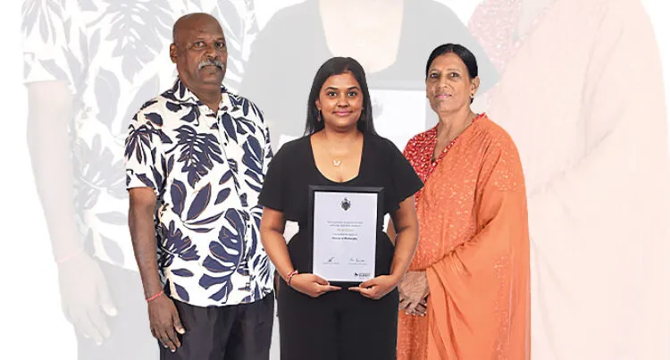 Pooja Chand is flanked by her parents Philip Anil and Sarojni Chand.
