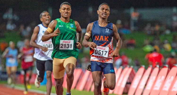 A photo of Veresa Valemei running ahead of two competitors.
