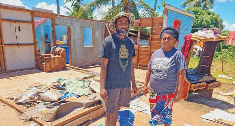  Setariki Matanidaku and Nina Taiviu standing in front of the ruins of their home at Sarava, Labasa on March 19, 2025.