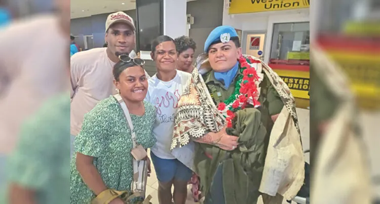 Private Mereani Wakolo (with garland), surrounded by family members at the Nadi International Airport on January 27, 2025.